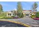 Charming clubhouse with a welcoming entrance, pergola, and beautifully landscaped grounds at 882 Eldorado Dr, Superior, CO 80027