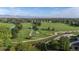 Scenic aerial view of the green golf course, with sand traps and trees near Superior community at 882 Eldorado Dr, Superior, CO 80027