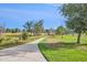 Scenic community walking path surrounded by lush greenery and mature trees at 882 Eldorado Dr, Superior, CO 80027