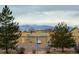 Scenic view of mountains from the apartment complex, framed by pine trees at 8460 Decatur St # 138, Westminster, CO 80031