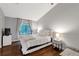 Bright bedroom with hardwood floors, and a large window that offers ample natural light at 8787 W Cornell Ave # 6, Lakewood, CO 80227