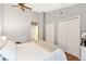 Well-lit bedroom featuring high ceilings and double closets for ample storage space at 8787 W Cornell Ave # 6, Lakewood, CO 80227