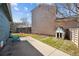 Backyard of home featuring grass, concrete patio, and a small shed with a wooden fence in the background at 1625 19Th Ave, Longmont, CO 80501