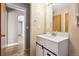 Bathroom vanity featuring white cabinets, modern sink, and updated mirror at 1625 19Th Ave, Longmont, CO 80501