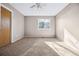 Bright bedroom with neutral carpet, a ceiling fan, and a sunny window at 1625 19Th Ave, Longmont, CO 80501