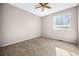 Neutral bedroom with light walls, carpet, and a ceiling fan at 1625 19Th Ave, Longmont, CO 80501