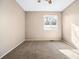 Neutral bedroom featuring light walls, carpet flooring, and updated window at 1625 19Th Ave, Longmont, CO 80501