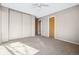 Neutral bedroom features tan walls, carpet flooring, ceiling fan, and ample closet space at 1625 19Th Ave, Longmont, CO 80501