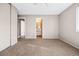 Bedroom features neutral carpet, closet, and an ensuite bathroom entrance at 1625 19Th Ave, Longmont, CO 80501