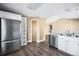 Bright kitchen featuring stainless steel refrigerator and modern white cabinetry at 1625 19Th Ave, Longmont, CO 80501