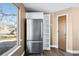 Bright kitchen featuring stainless steel refrigerator, next to a window and a shelf at 1625 19Th Ave, Longmont, CO 80501