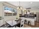 Charming kitchen with a cozy dining nook and stainless steel appliances overlooking the backyard at 972 Park View St, Castle Rock, CO 80104