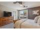 Comfortable main bedroom featuring a ceiling fan, natural light, and dresser at 972 Park View St, Castle Rock, CO 80104