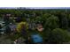 A beautiful property boasts mature trees, a basketball court, large manicured lawn, and an inviting outdoor space at 5653 E Southmoor Cir, Englewood, CO 80111