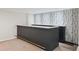 Basement bar with ample seating, granite countertop, wood accent wall and accent lighting at 5653 E Southmoor Cir, Englewood, CO 80111
