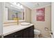 Bathroom with a granite-look vanity top, white vessel sink and floral accents at 5653 E Southmoor Cir, Englewood, CO 80111