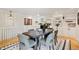 Dining room features hardwood floors, built-in cabinets, and access to kitchen at 5653 E Southmoor Cir, Englewood, CO 80111