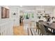 Dining room features hardwood floors, open to kitchen, and built-in cabinets at 5653 E Southmoor Cir, Englewood, CO 80111