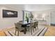 Formal dining room with large table and chairs with lots of natural light at 5653 E Southmoor Cir, Englewood, CO 80111