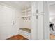 Entryway features custom cabinets, bench, and storage at 5653 E Southmoor Cir, Englewood, CO 80111