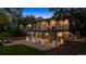Exterior of the home showing the deck, patio, and lovely landscaping at 5653 E Southmoor Cir, Englewood, CO 80111
