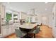 Bright eat-in kitchen features custom cabinets, stainless steel appliances, and hardwood floors at 5653 E Southmoor Cir, Englewood, CO 80111