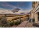 Manicured backyard with decorative fountain and stunning golf course views at 7851 E 148Th Dr, Thornton, CO 80602