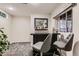 Basement bar area featuring a granite countertop, mirror, two chairs, and a window with a scenic view at 7851 E 148Th Dr, Thornton, CO 80602