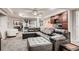 Finished basement with a spacious lounge area, wet bar, and stylish decor at 7851 E 148Th Dr, Thornton, CO 80602