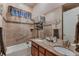 Bathroom boasting double sinks with granite countertops and a separate tub and shower at 7851 E 148Th Dr, Thornton, CO 80602