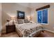 Comfortable bedroom with carpet, a large window, and tasteful decor at 7851 E 148Th Dr, Thornton, CO 80602