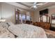 This main bedroom boasts carpet, large bay windows with backyard views and beautiful dressers at 7851 E 148Th Dr, Thornton, CO 80602