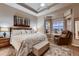 This main bedroom boasts carpet, a ceiling fan and large bay windows with backyard views at 7851 E 148Th Dr, Thornton, CO 80602