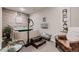 Relaxing spa room with a built-in hot tub, wooden accents, and comfortable seating at 7851 E 148Th Dr, Thornton, CO 80602