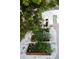 Landscaped backyard with stone, planters, and black Adirondack chairs at 4212 Lowell Blvd, Denver, CO 80211