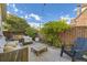 This backyard has a rug, fence, chairs, and plants. A beautiful outdoor space! at 4212 Lowell Blvd, Denver, CO 80211