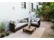 Cozy backyard features an outdoor lounge and hot tub, ideal for relaxation and entertaining at 4212 Lowell Blvd, Denver, CO 80211