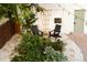 Charming backyard with gravel, stone, planters, and black Adirondack chairs at 4212 Lowell Blvd, Denver, CO 80211