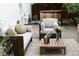 Inviting backyard patio features comfortable seating, stylish rug, and a relaxing hot tub at 4212 Lowell Blvd, Denver, CO 80211