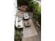 Aerial view of cozy backyard with hot tub, patio furniture, string lights, and stylish outdoor rug at 4212 Lowell Blvd, Denver, CO 80211