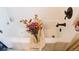 Bright bathtub with flowers, a modern faucet, and stylish decor at 4212 Lowell Blvd, Denver, CO 80211