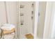 Clean white shower boasts modern fixtures and shelving for bath products, paired with neat towel storage at 4212 Lowell Blvd, Denver, CO 80211
