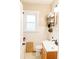 Bright bathroom featuring a vintage sink, modern fixtures, and decorative accents at 4212 Lowell Blvd, Denver, CO 80211