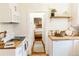 Bright kitchen featuring white subway tile, wood countertops, and modern appliances at 4212 Lowell Blvd, Denver, CO 80211