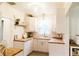 Bright, updated kitchen with white cabinets, butcher block countertops, and subway tile backsplash at 4212 Lowell Blvd, Denver, CO 80211