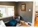 Home office featuring natural light, unique art and modern decor with hardwood floors at 4212 Lowell Blvd, Denver, CO 80211