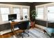 Comfortable home office filled with natural light from large windows and a modern design at 4212 Lowell Blvd, Denver, CO 80211