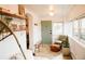 Inviting sunroom filled with natural light, stylish seating, and unique decor at 4212 Lowell Blvd, Denver, CO 80211