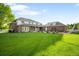 Expansive backyard with lush green lawn and manicured landscaping at 5700 S Steele St, Greenwood Village, CO 80121