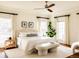 Sunlit bedroom with neutral tones, plush bedding, and a ceiling fan at 5700 S Steele St, Greenwood Village, CO 80121